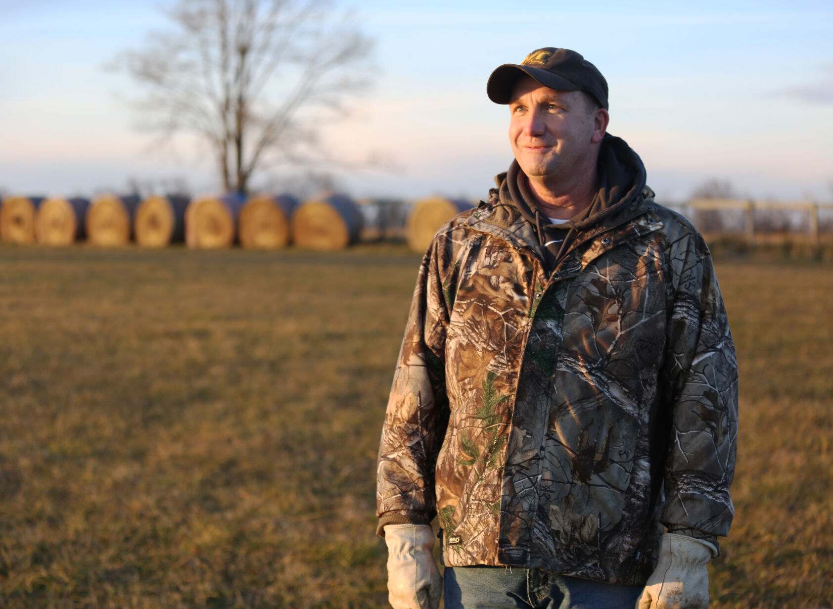 Brian Neuner stands in a field